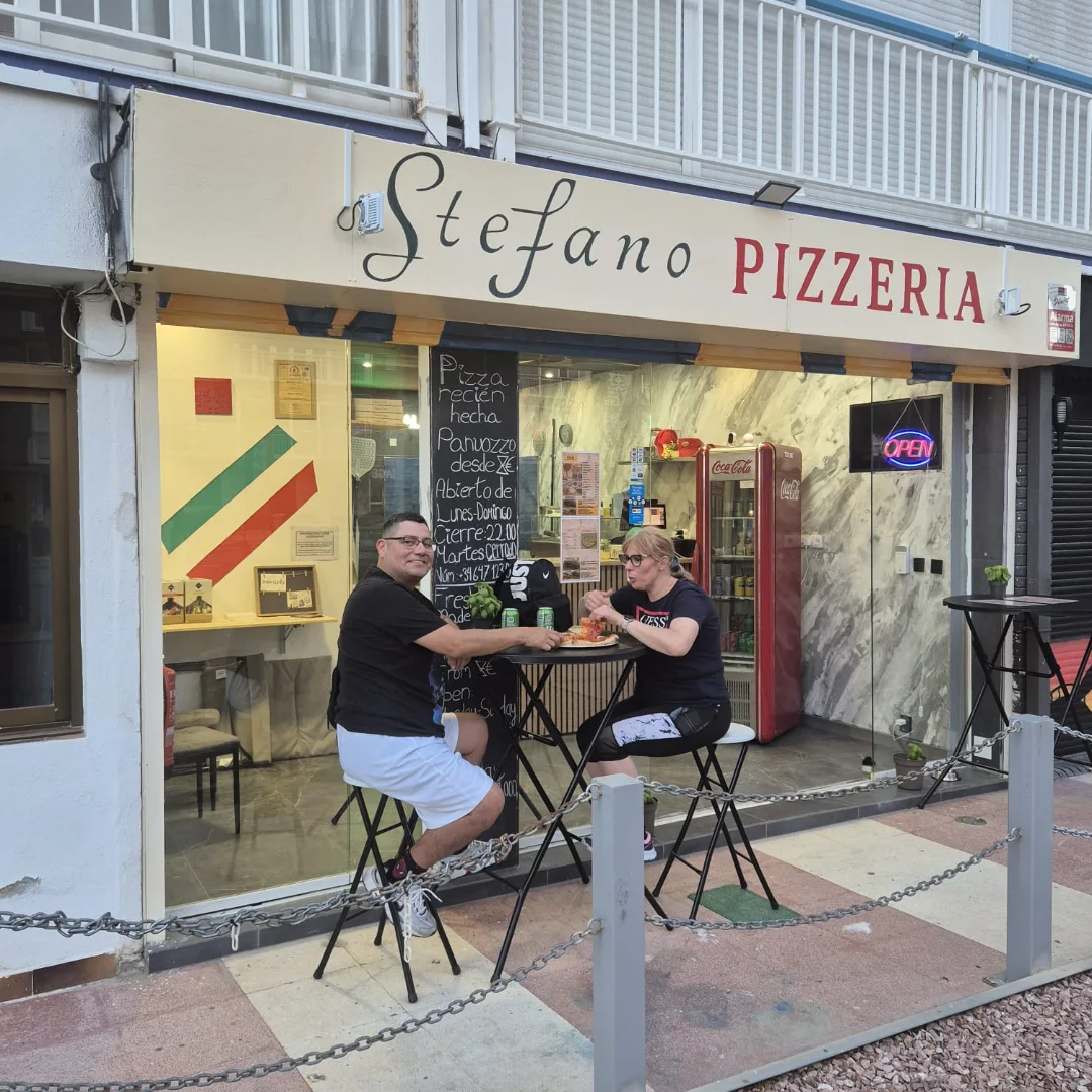 The storefront — guests on the terrace