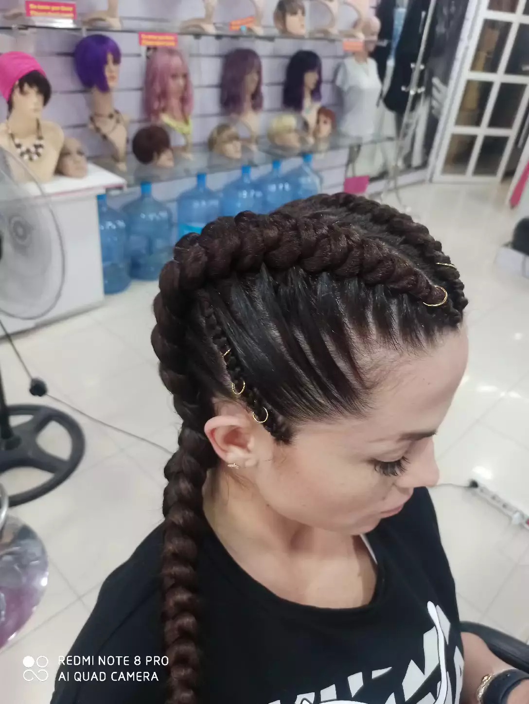 Cornrows finished with gold cuffs