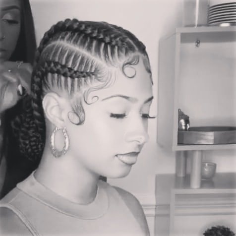 Sleek freestyle cornrows with soft swirls
